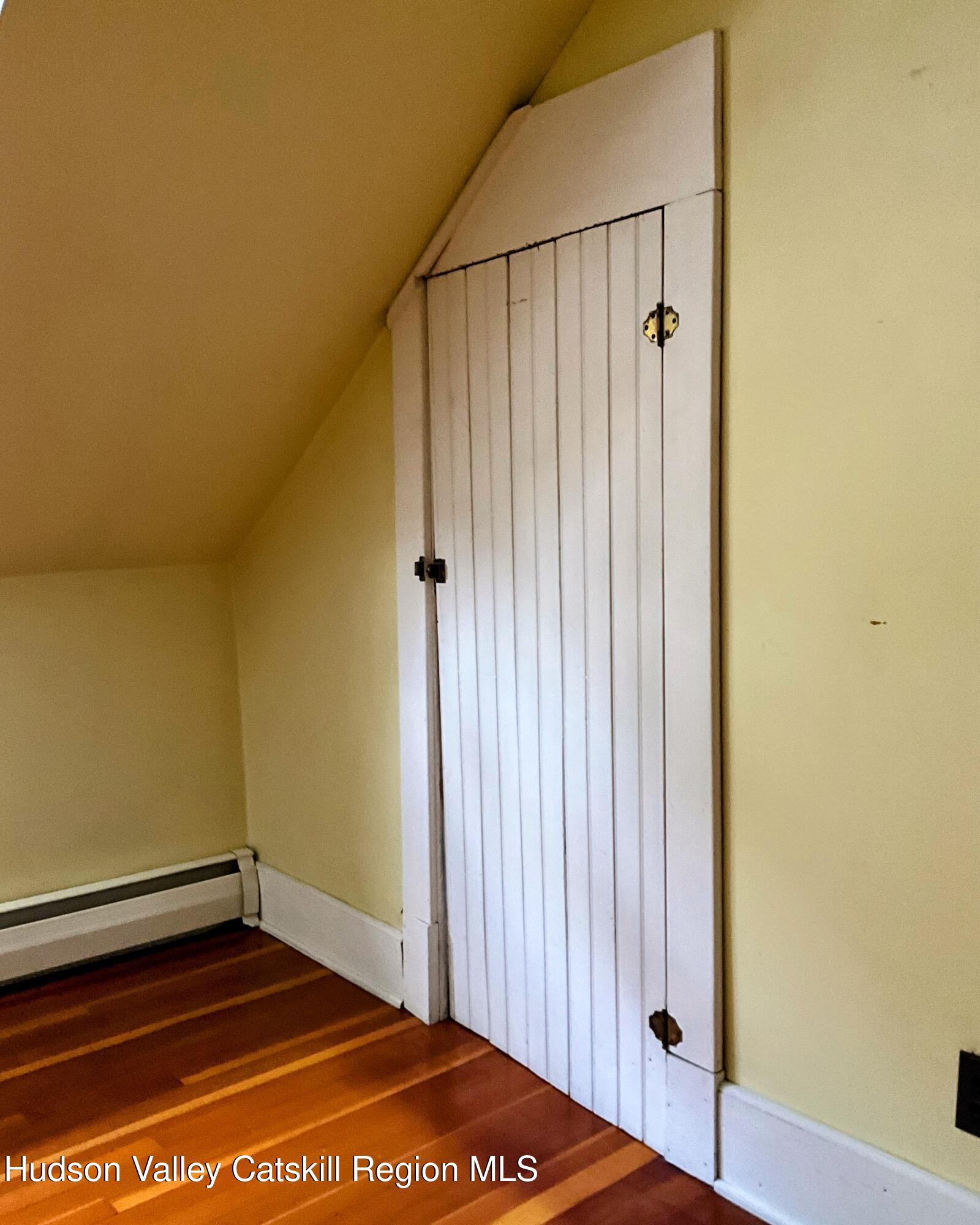 729 Springtown Road Tillson, NY 12486 - Photo 25 of 52 a view of a room with wooden floor and a cabinet