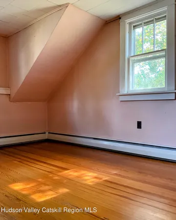 a view of a porch with wooden floor