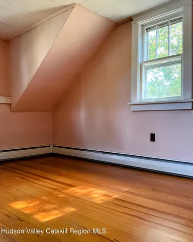 a view of a porch with wooden floor