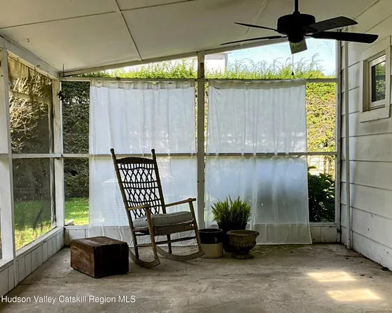 a view of a backyard with table and chairs