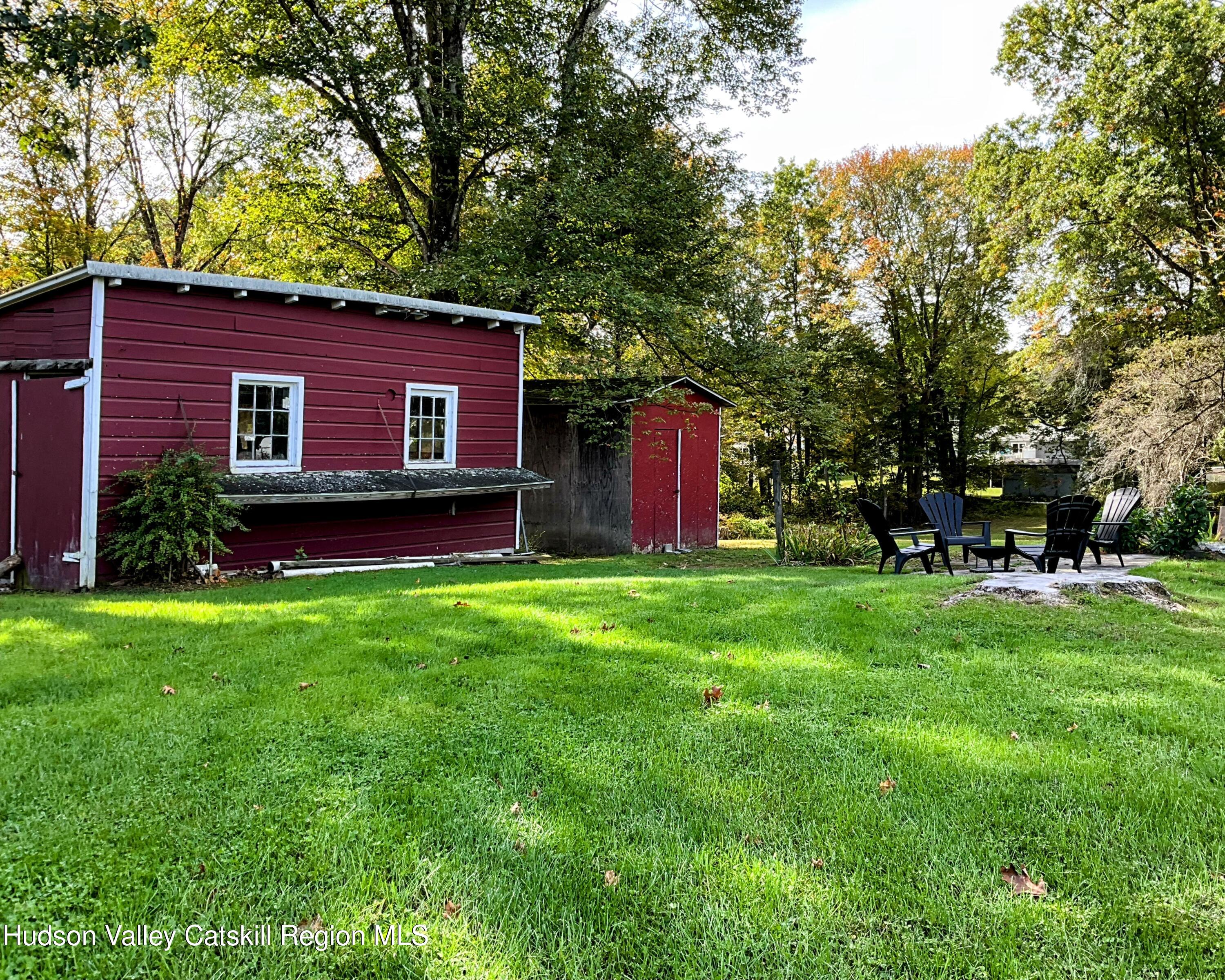 729 Springtown Road Tillson, NY 12486 - Photo 40 of 52 a backyard of a house with table and chairs