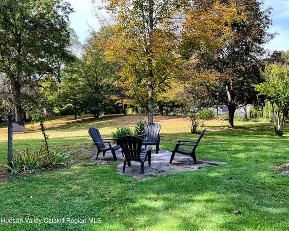 a view of a swimming pool with a yard