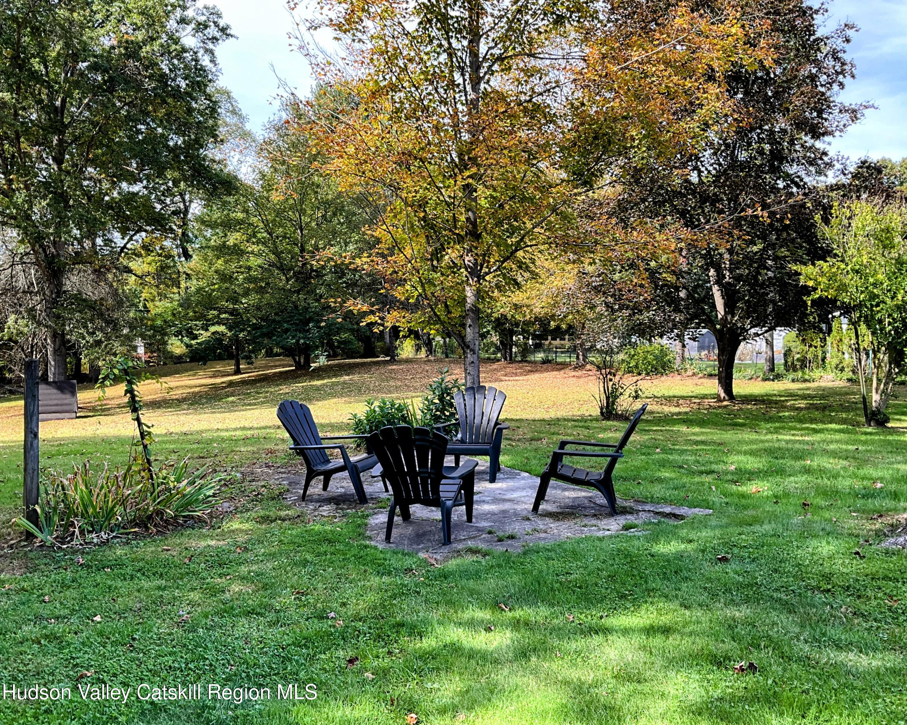 729 Springtown Road Tillson, NY 12486 - Photo 41 of 52 a view of a backyard with table and chairs