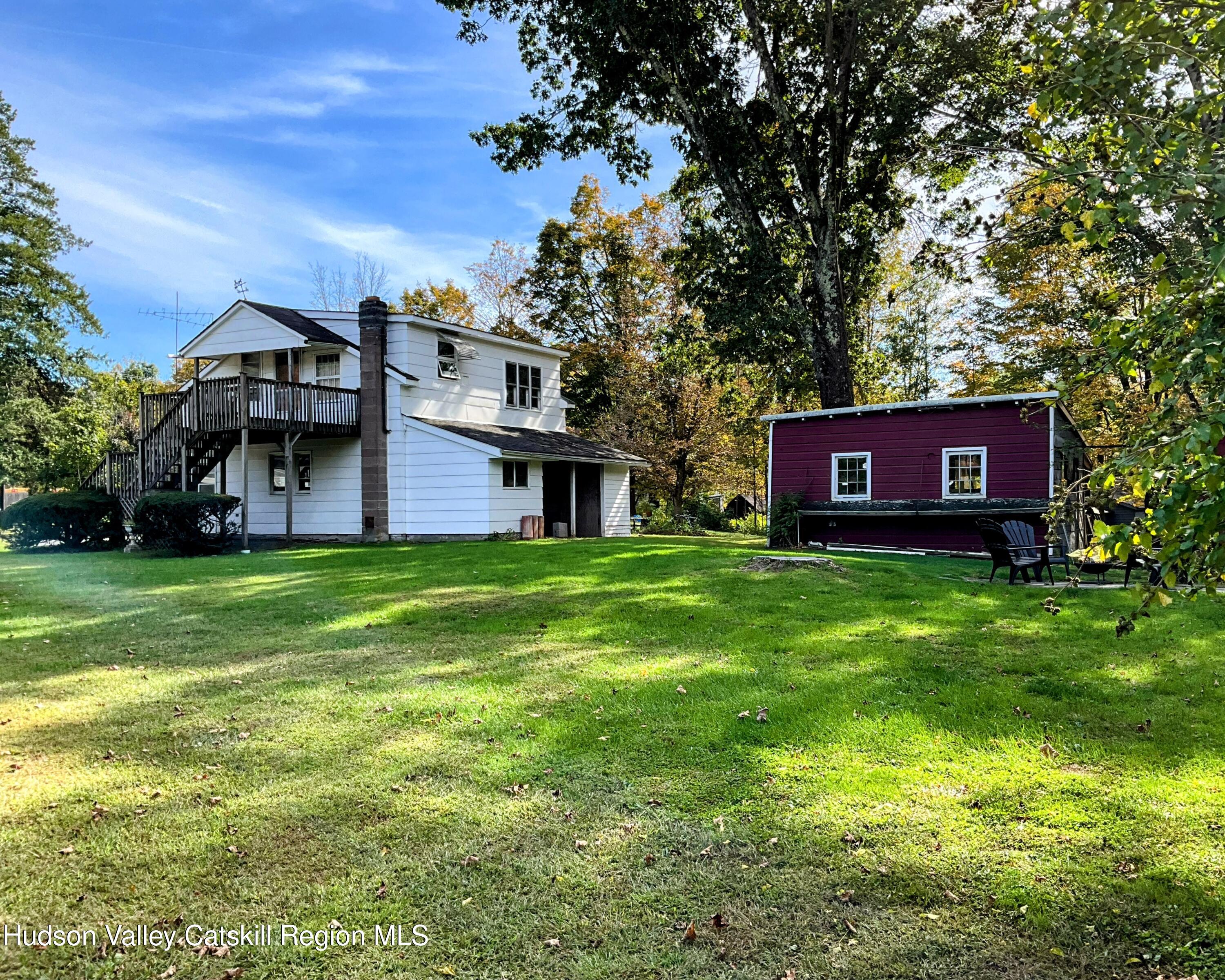 729 Springtown Road Tillson, NY 12486 - Photo 47 of 52 a view of a house with a big yard and large trees