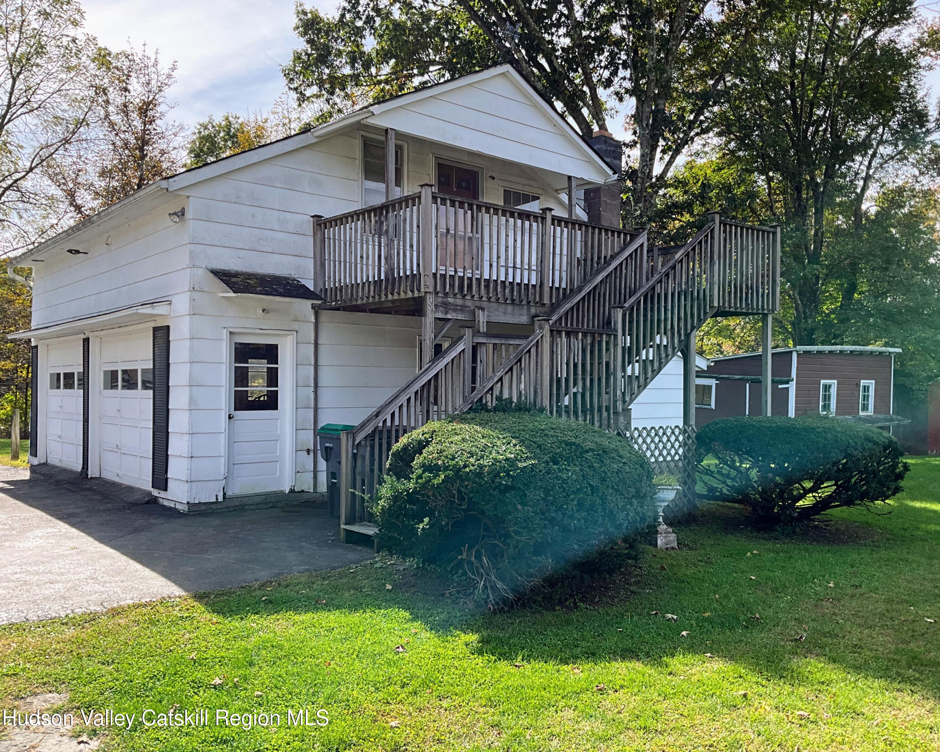 729 Springtown Road Tillson, NY 12486 - Photo 48 of 52 a view of a house with a yard plants and large tree