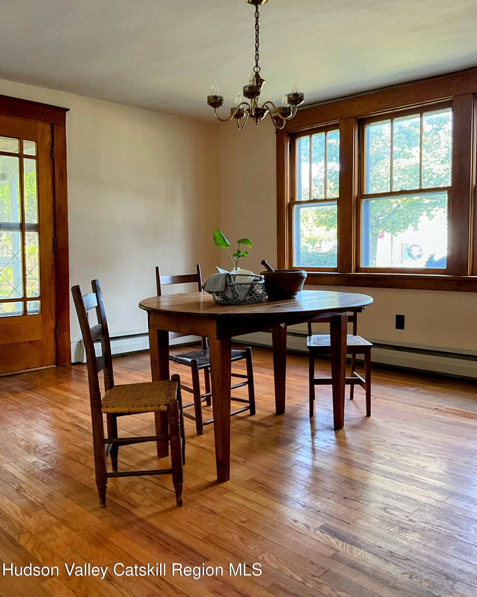 729 Springtown Road Tillson, NY 12486 - Photo 8 of 52 a view of a a dining room with furniture window and wooden floor
