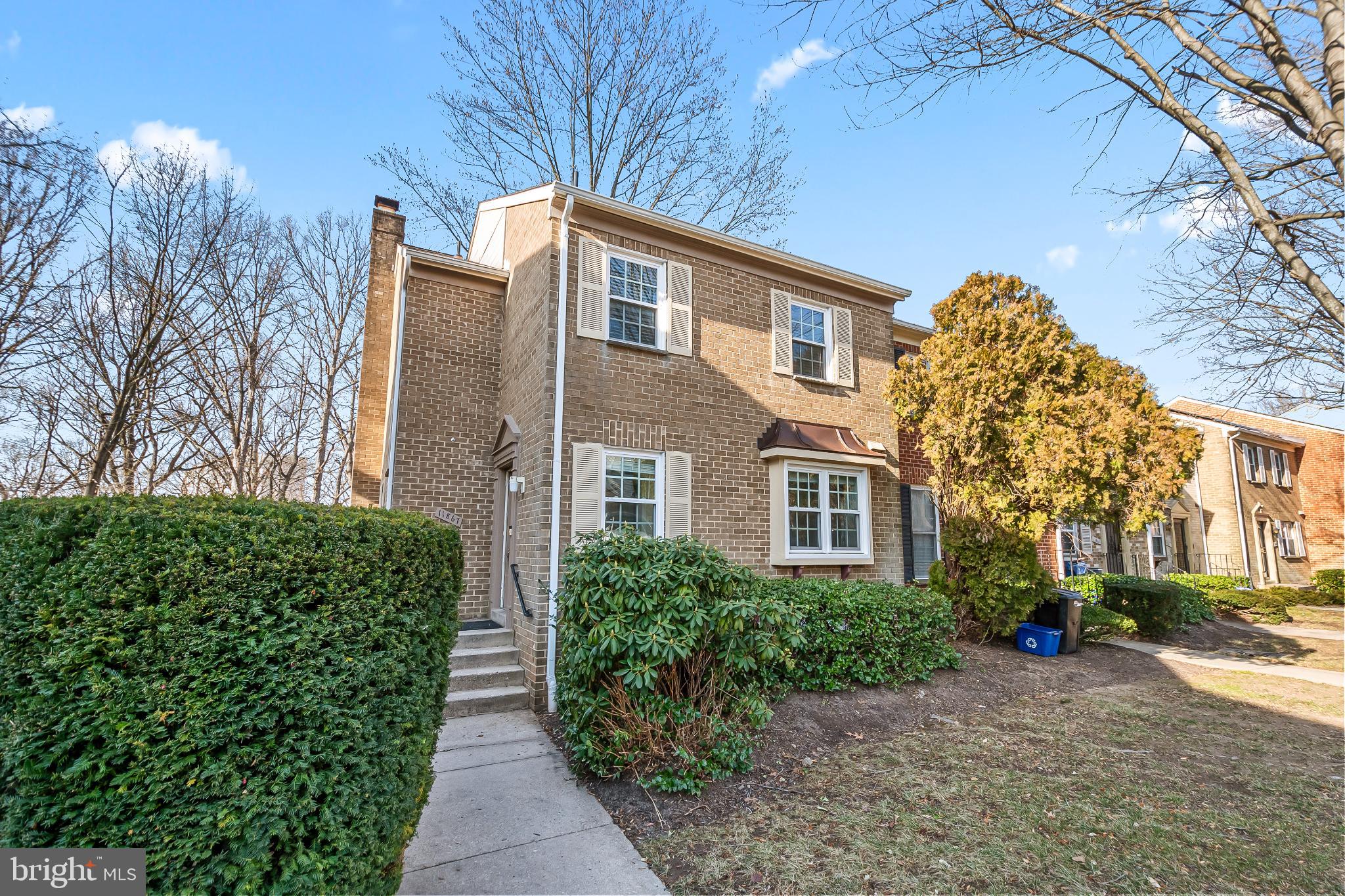 a view of a pathway with a house in the background