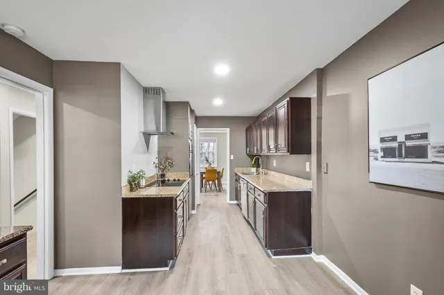 a kitchen view with stainless steel appliances lots of counter top space and cabinets