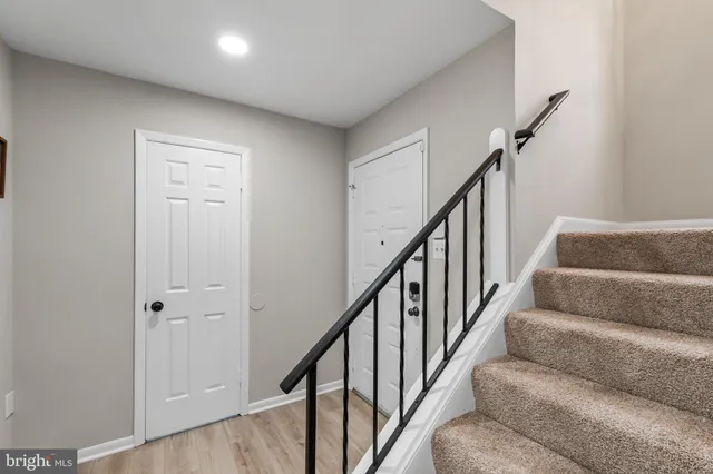 a view of staircase with wooden floor and stairs