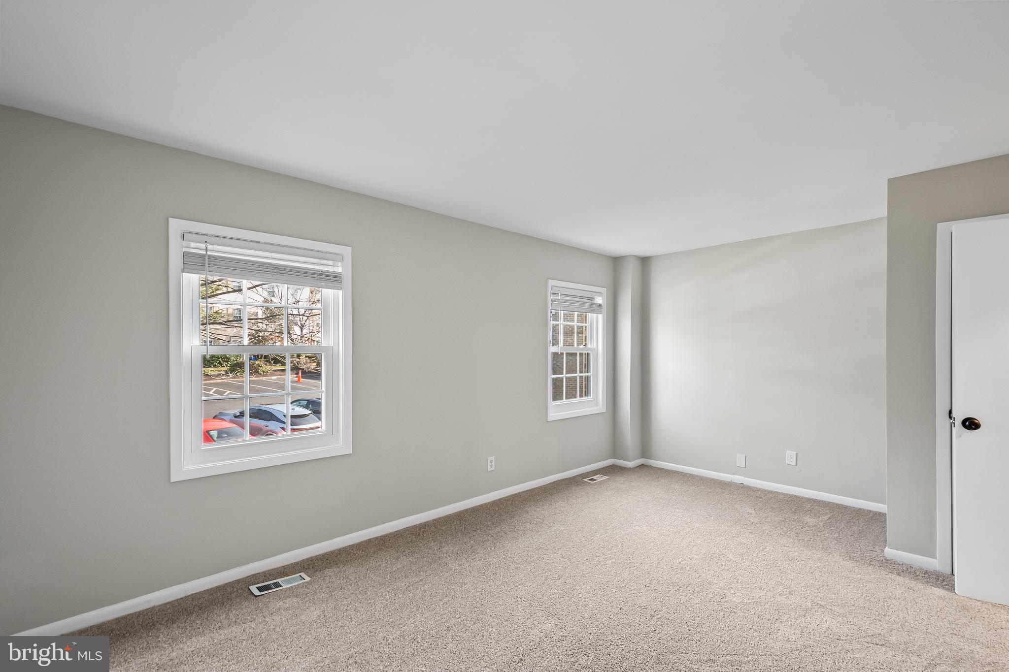 11867 Old Columbia Pike, Unit 75 Silver Spring, MD 20904 - Photo 16 of 41 an empty room with windows