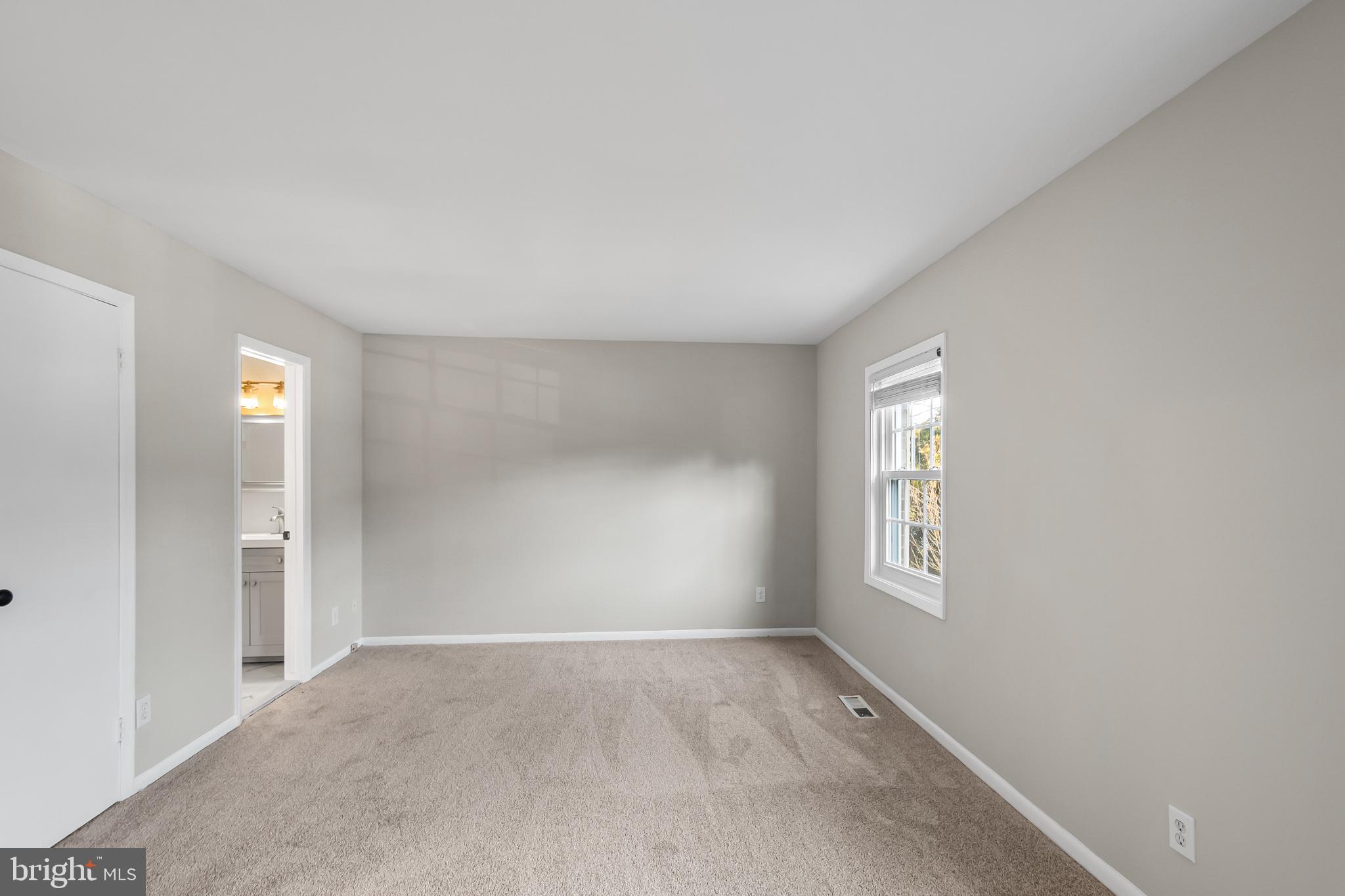 11867 Old Columbia Pike, Unit 75 Silver Spring, MD 20904 - Photo 20 of 41 an empty room with windows