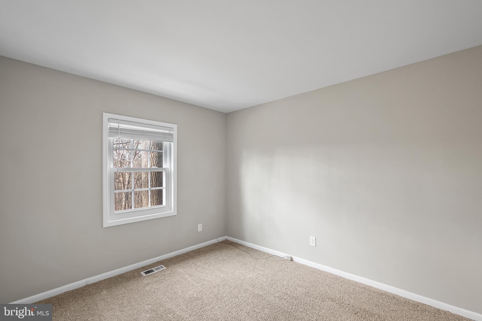 11867 Old Columbia Pike, Unit 75 Silver Spring, MD 20904 - Photo 24 of 41 an empty room with windows