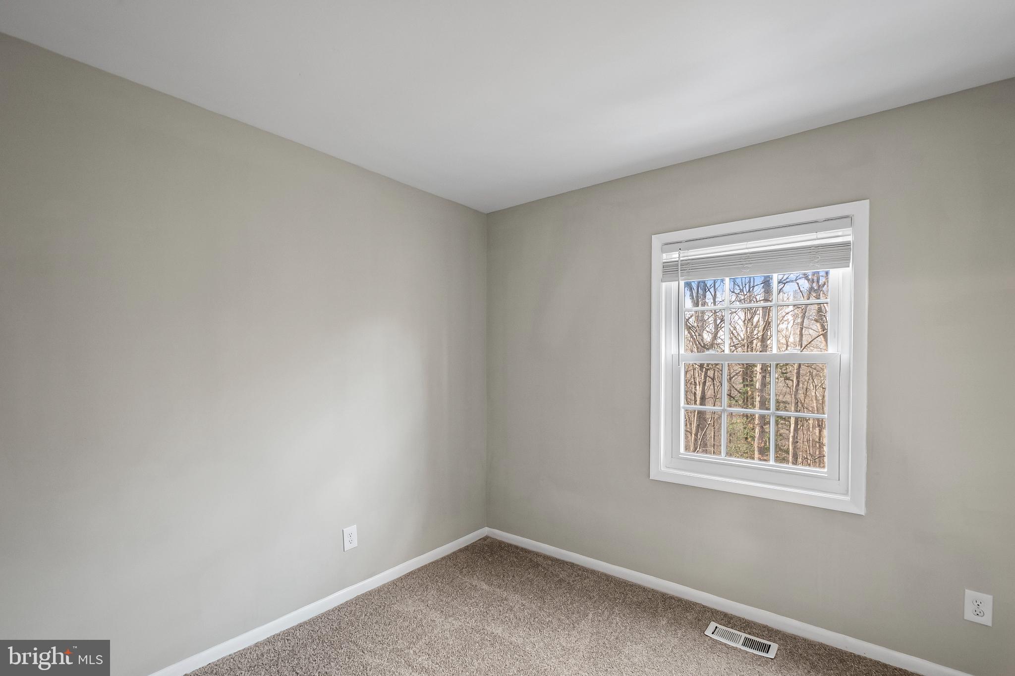 11867 Old Columbia Pike, Unit 75 Silver Spring, MD 20904 - Photo 26 of 41 an empty room with a window