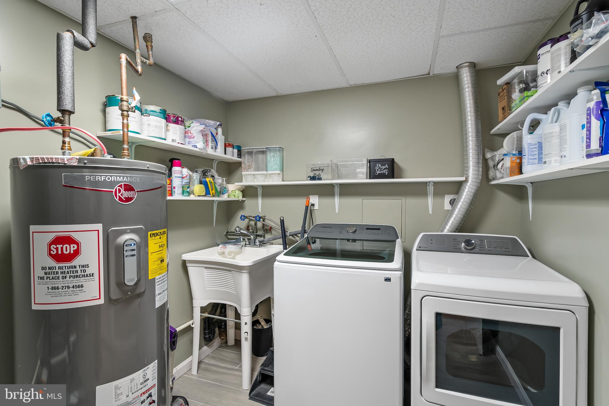 11867 Old Columbia Pike, Unit 75 Silver Spring, MD 20904 - Photo 30 of 41 a utility room with dryer and washer