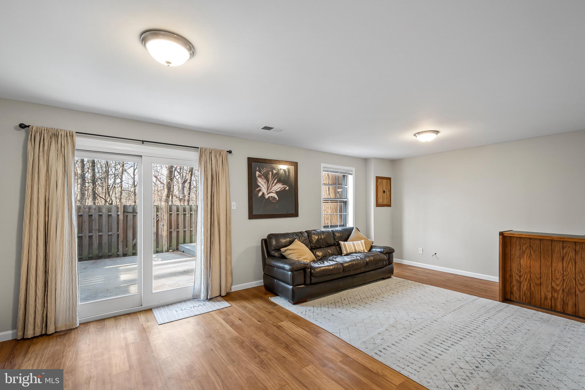 11867 Old Columbia Pike, Unit 75 Silver Spring, MD 20904 - Photo 34 of 41 a living room with furniture and a window