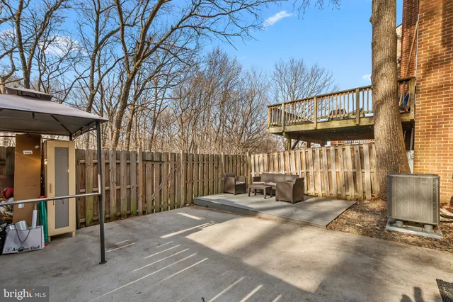 a view of a building with a bench in a patio
