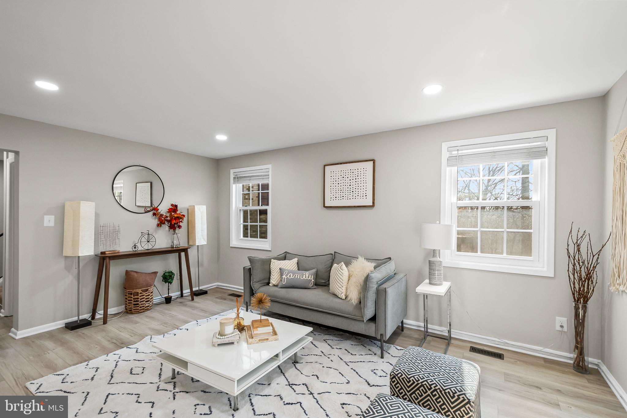 11867 Old Columbia Pike, Unit 75 Silver Spring, MD 20904 - Photo 5 of 41 a living room with furniture a rug and a window