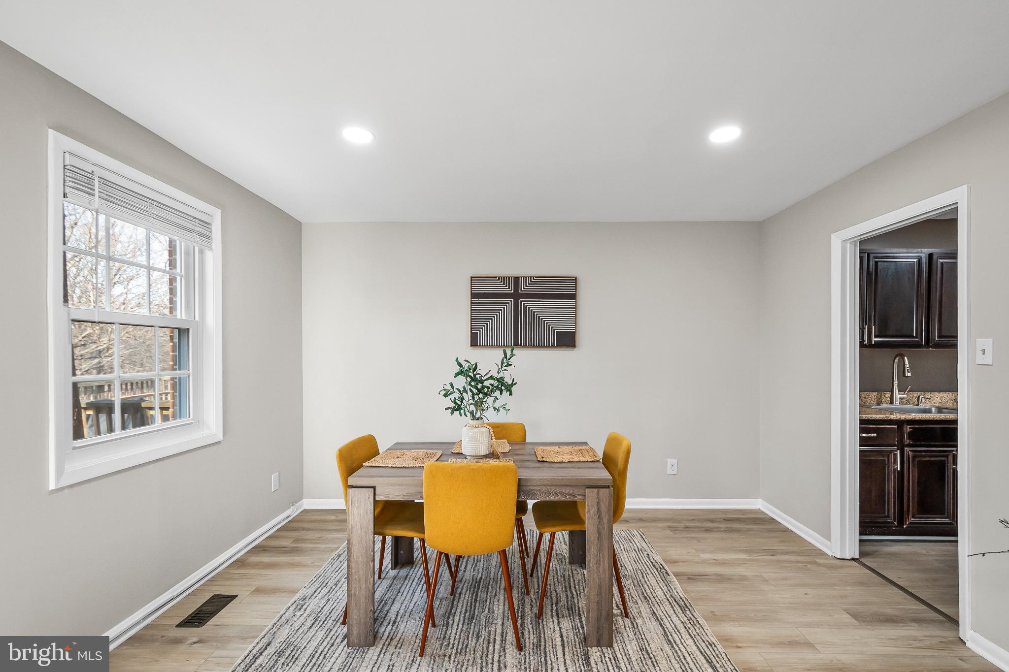 11867 Old Columbia Pike, Unit 75 Silver Spring, MD 20904 - Photo 9 of 41 a dining room with furniture and window