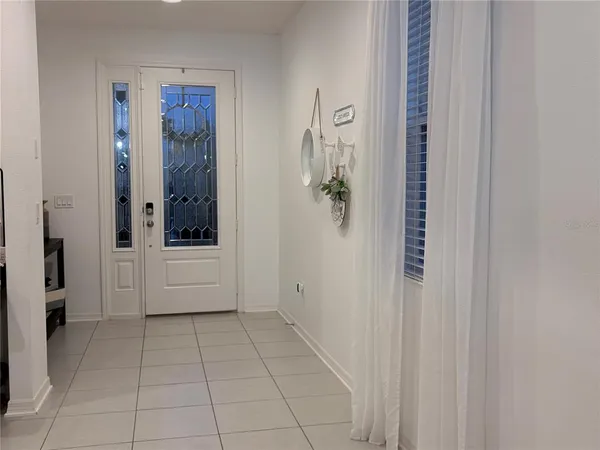 a view of an entryway with a chandelier
