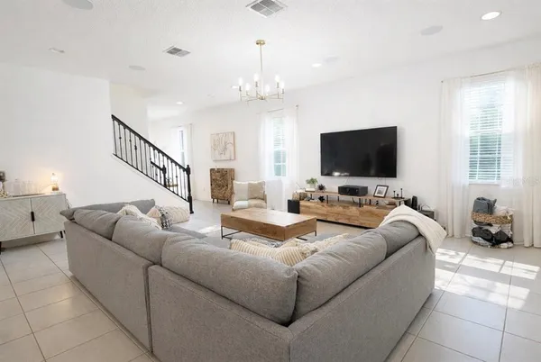 a living room with furniture and a flat screen tv