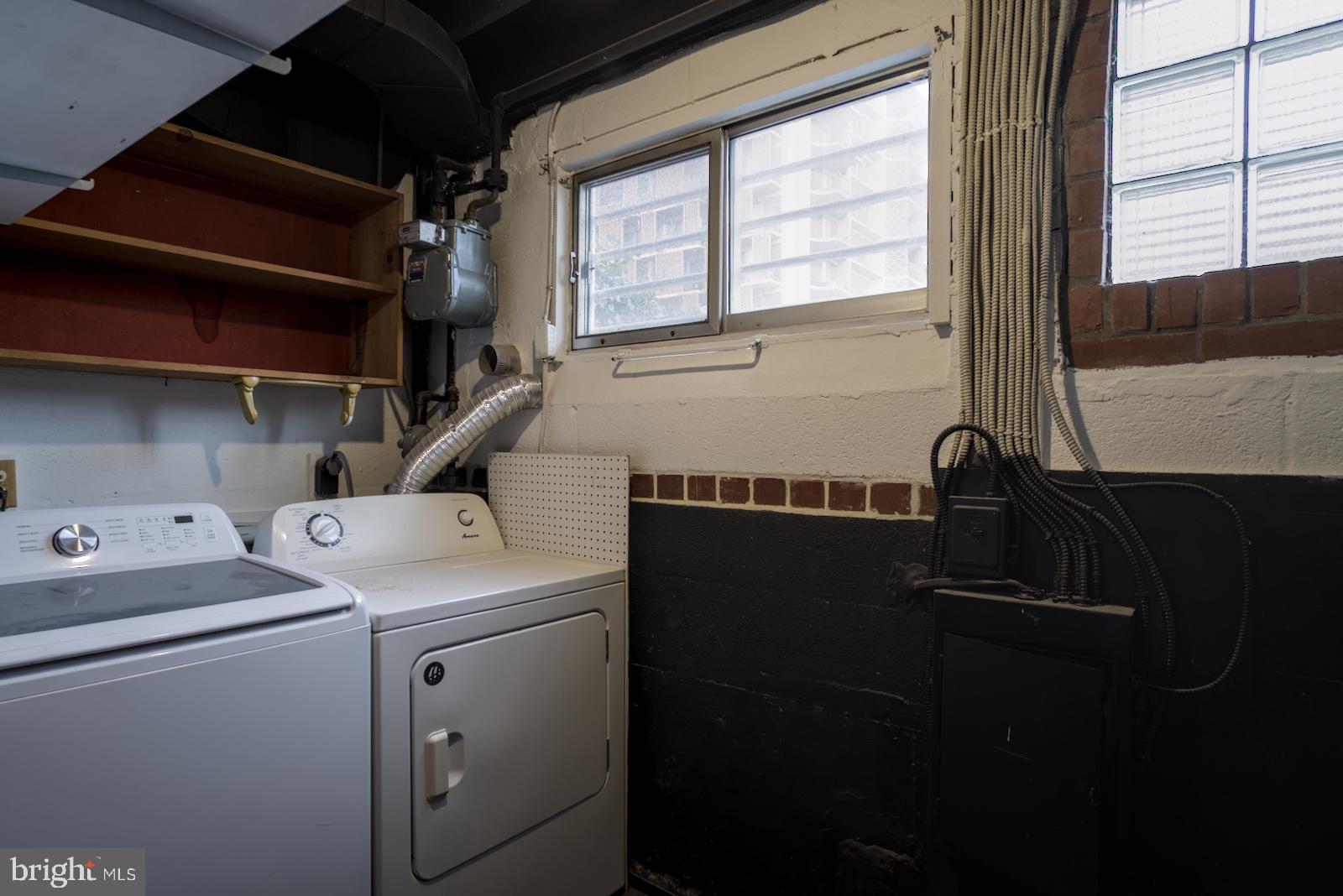 301 I Street Southwest, Unit 108 Washington, DC 20024 - Photo 13 of 66 a utility room with dryer and washer