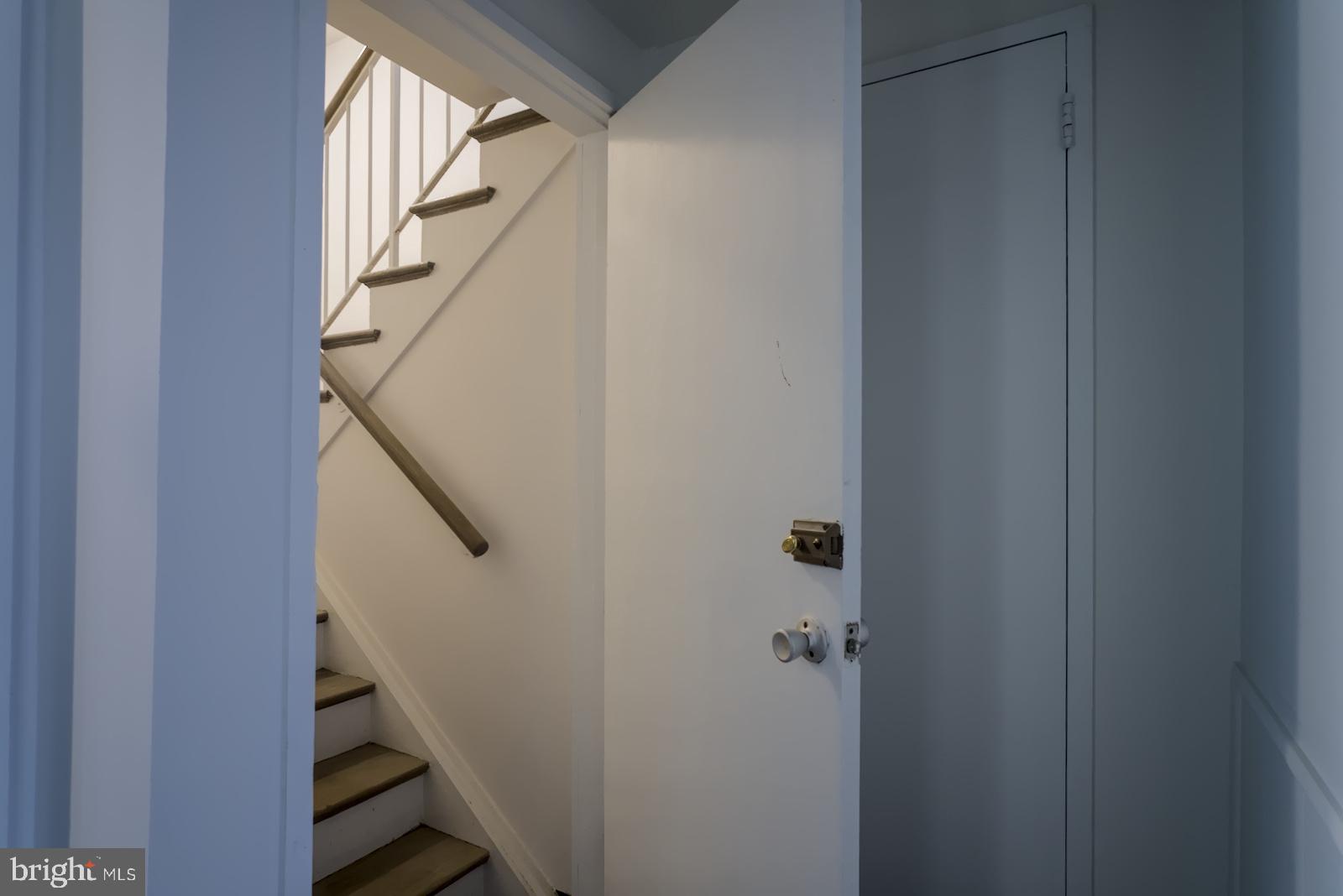 301 I Street Southwest, Unit 108 Washington, DC 20024 - Photo 14 of 66 a view of staircase with wooden floor and white walls