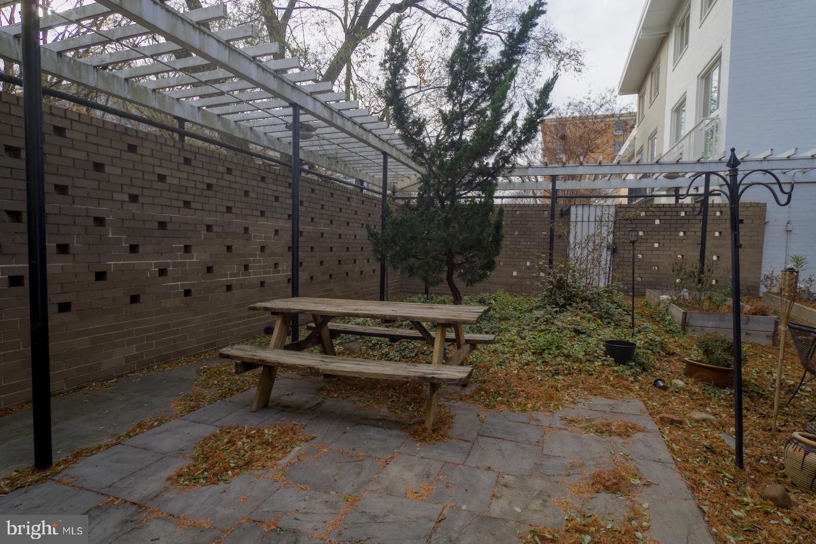 301 I Street Southwest, Unit 108 Washington, DC 20024 - Photo 18 of 66 a view of a bench in a backyard