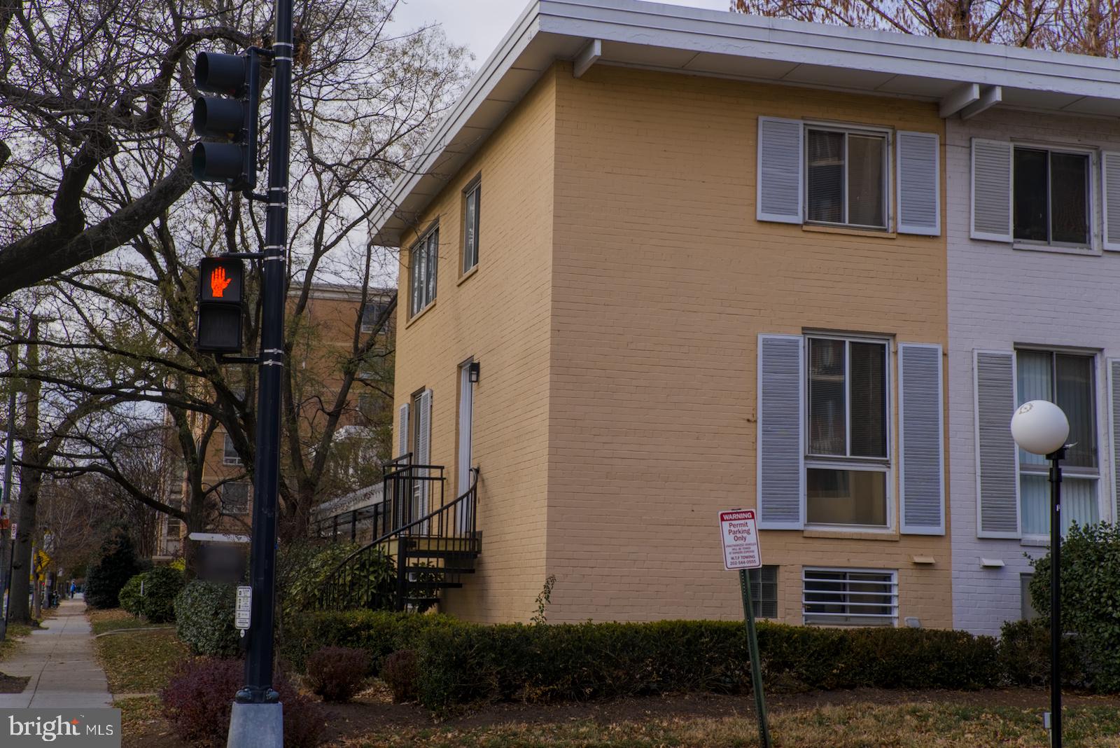 301 I Street Southwest, Unit 108 Washington, DC 20024 - Photo 20 of 66 a front view of a house with a yard