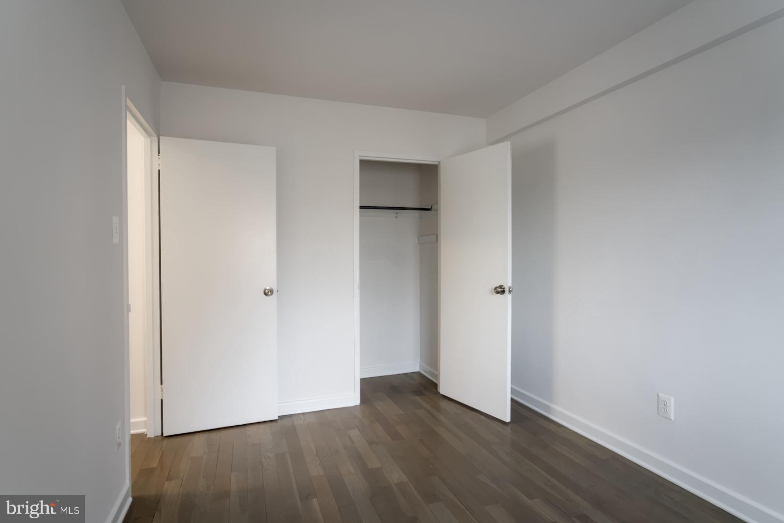 301 I Street Southwest, Unit 108 Washington, DC 20024 - Photo 22 of 66 a view of an empty room with wooden floor