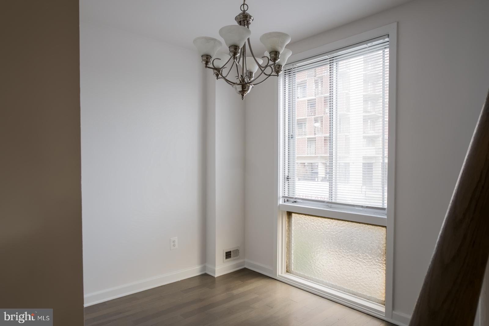 301 I Street Southwest, Unit 108 Washington, DC 20024 - Photo 28 of 66 a view of a large window with wooden floor