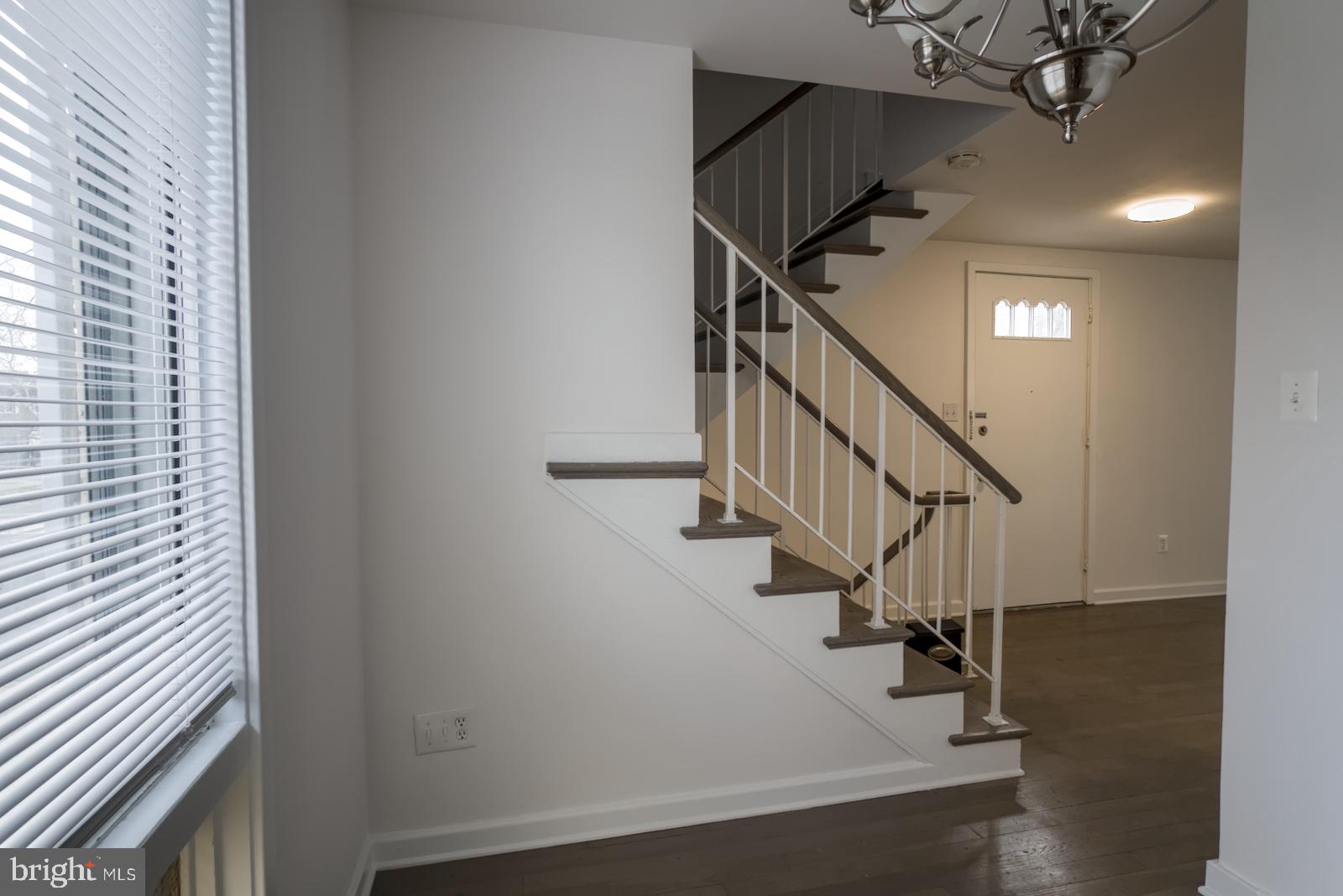 301 I Street Southwest, Unit 108 Washington, DC 20024 - Photo 4 of 66 a view of entryway and hall with wooden floor
