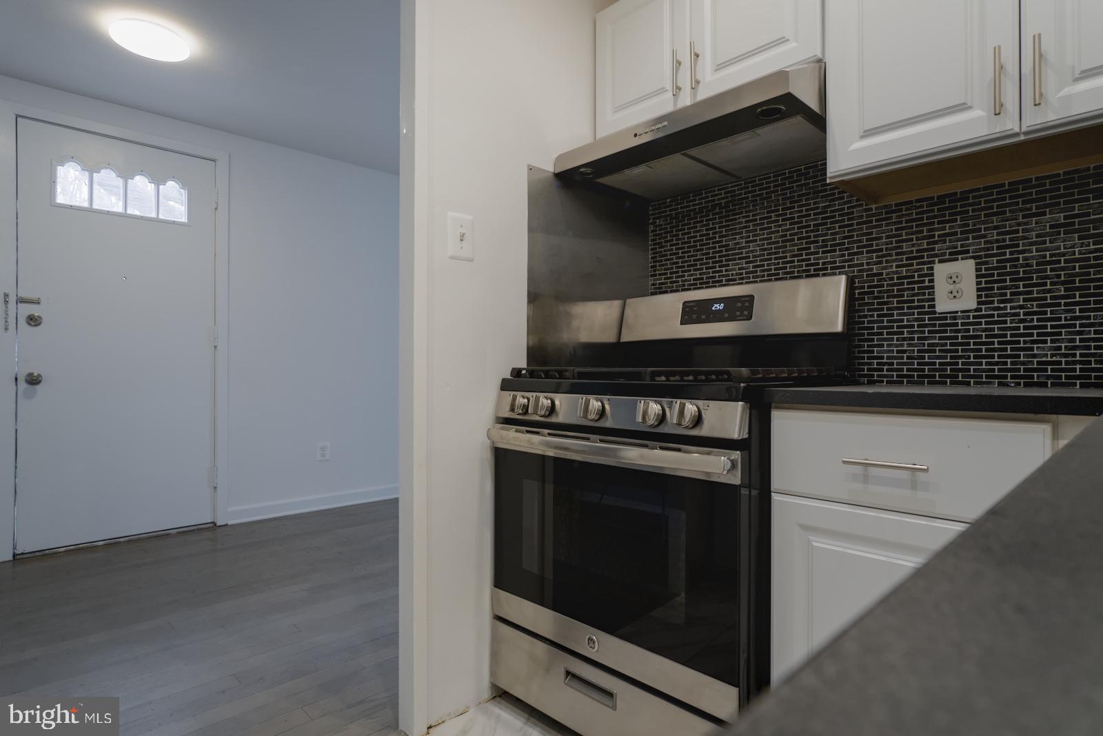 301 I Street Southwest, Unit 108 Washington, DC 20024 - Photo 6 of 66 a stove top oven sitting inside of a kitchen