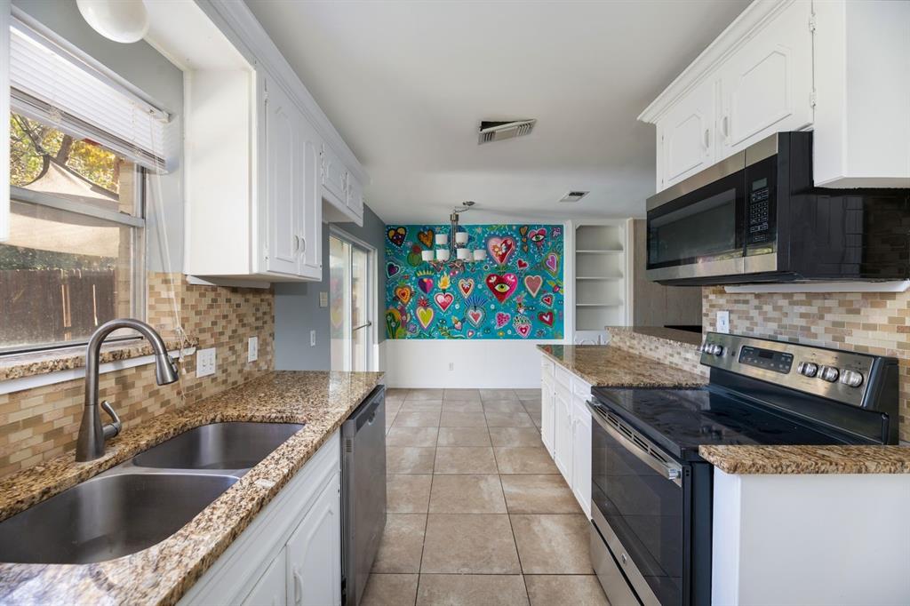 540 Billie Ruth Lane Hurst, TX 76053 - Photo 12 of 40 Kitchen with stainless steel appliances, white cabinets, and backsplash