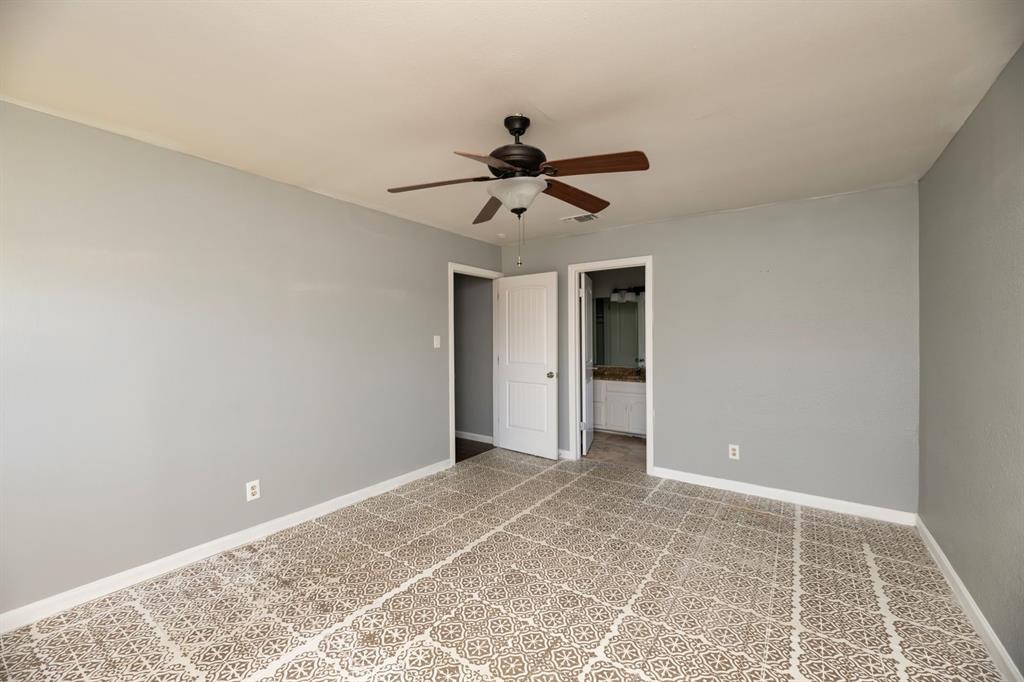 540 Billie Ruth Lane Hurst, TX 76053 - Photo 14 of 40 Unfurnished bedroom with ceiling fan and ensuite bathroom
