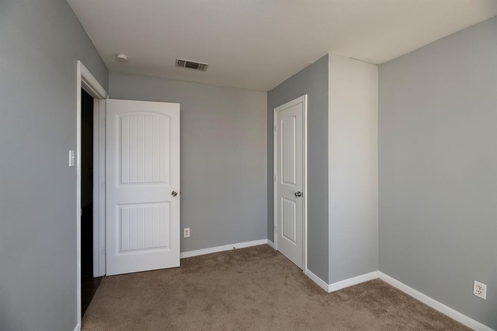 540 Billie Ruth Lane Hurst, TX 76053 - Photo 21 of 40 Unfurnished bedroom with carpet flooring and baseboards
