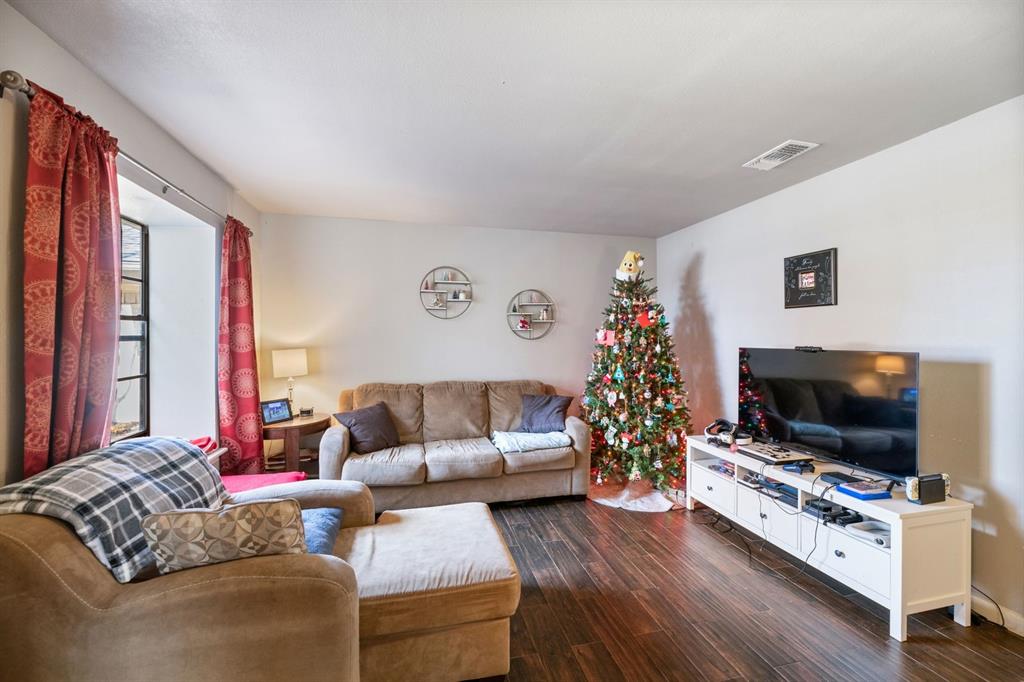 540 Billie Ruth Lane Hurst, TX 76053 - Photo 26 of 40 Living area with dark wood-type flooring