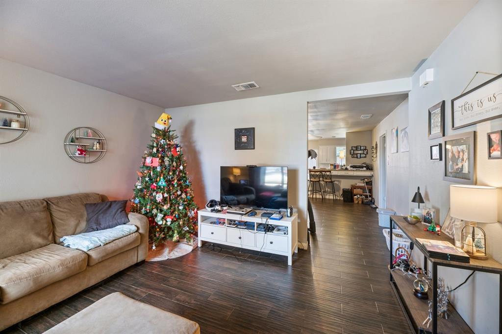 540 Billie Ruth Lane Hurst, TX 76053 - Photo 27 of 40 Living area featuring dark wood-style floors