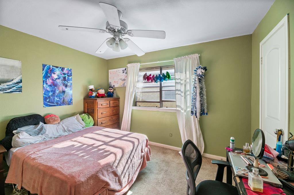 540 Billie Ruth Lane Hurst, TX 76053 - Photo 36 of 40 Carpeted bedroom featuring baseboards and ceiling fan