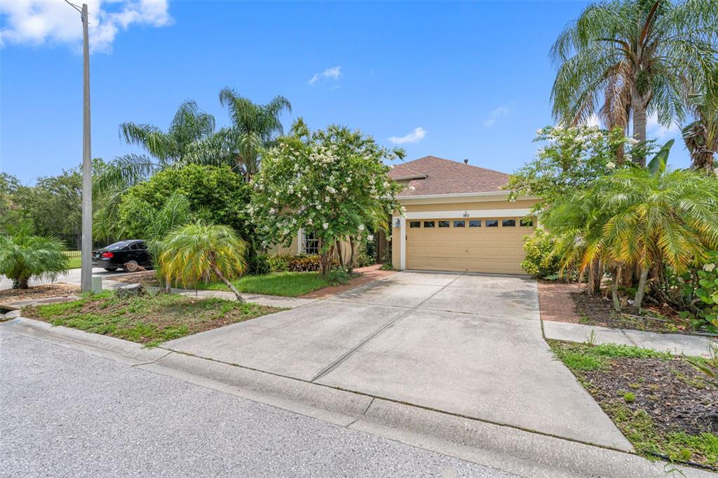 1812 Open Field Loop Brandon, FL 33510 - Photo 1 of 1 a front view of a house with a yard and garage