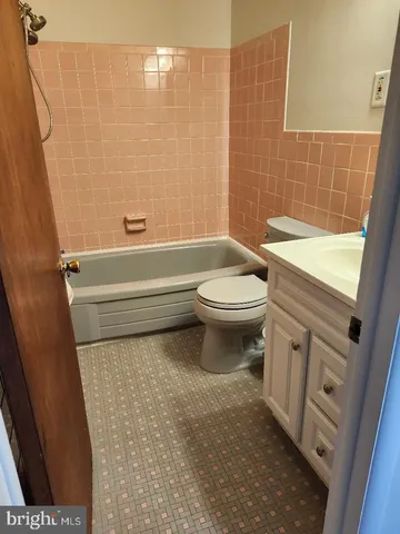 a bathroom with a toilet a sink and a shower