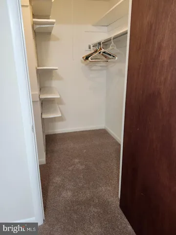 view of a room with rack on the wall