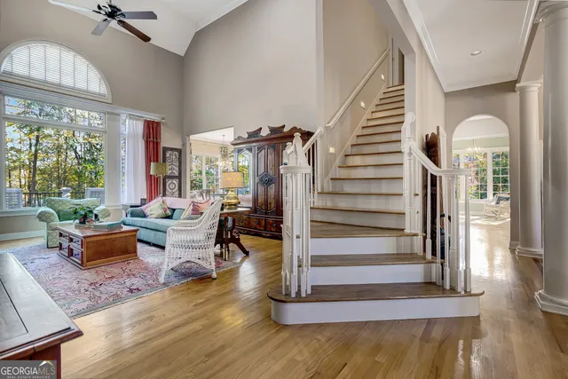 a view of a hallway with wooden floor