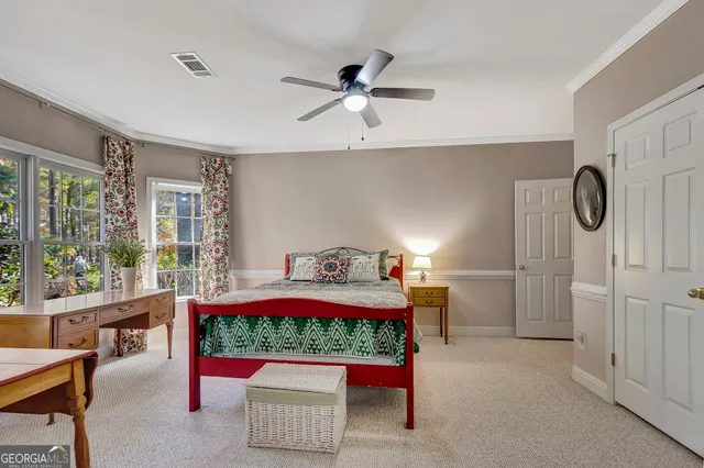 a bathroom with a granite countertop sink mirror vanity and toilet