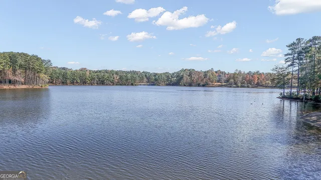 an aerial view of a house with a lake view