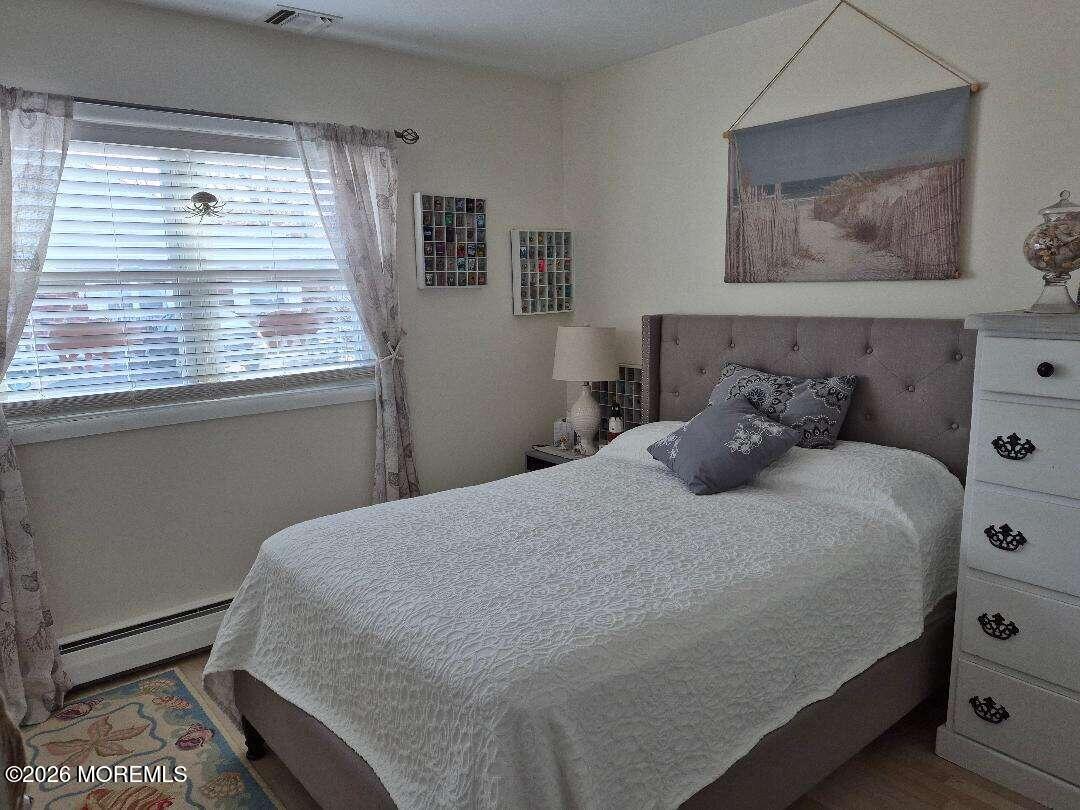 27 B Cedar Street Toms River, NJ 08757 - Photo 11 of 14 a bedroom with a bed and a window