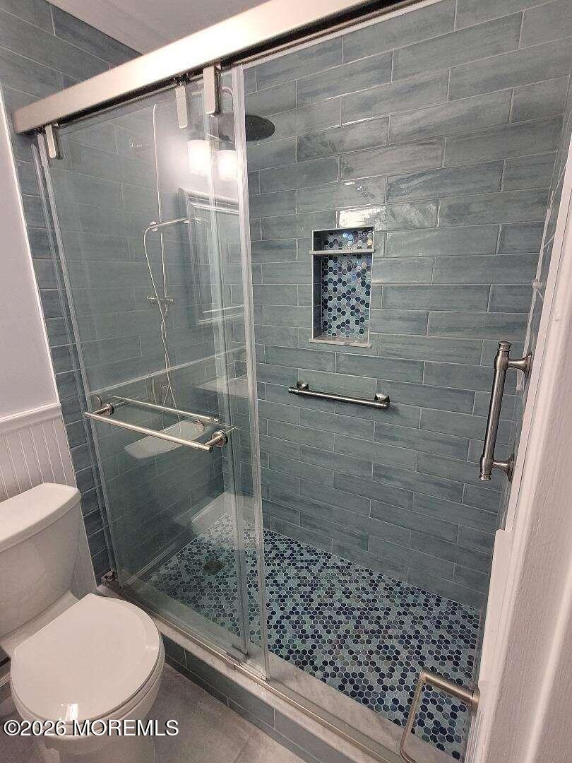 27 B Cedar Street Toms River, NJ 08757 - Photo 3 of 14 a bathroom with a toilet and a shower