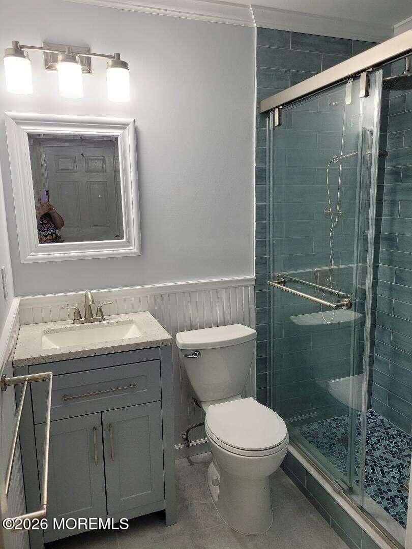 27 B Cedar Street Toms River, NJ 08757 - Photo 5 of 14 a bathroom with a sink a toilet and shower
