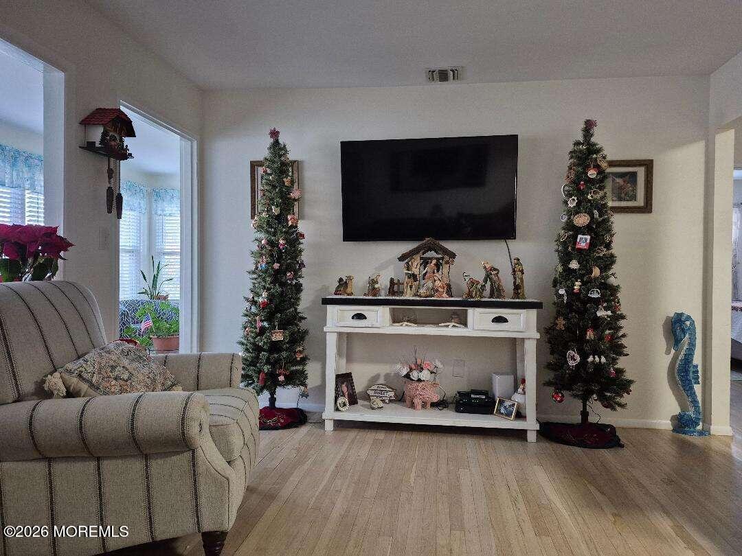 27 B Cedar Street Toms River, NJ 08757 - Photo 8 of 14 a living room with furniture and a flat screen tv