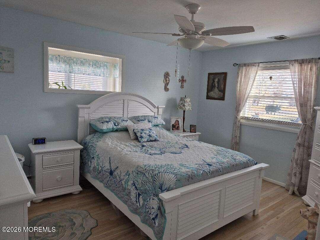 27 B Cedar Street Toms River, NJ 08757 - Photo 10 of 14 a bedroom with a bed dresser and a window