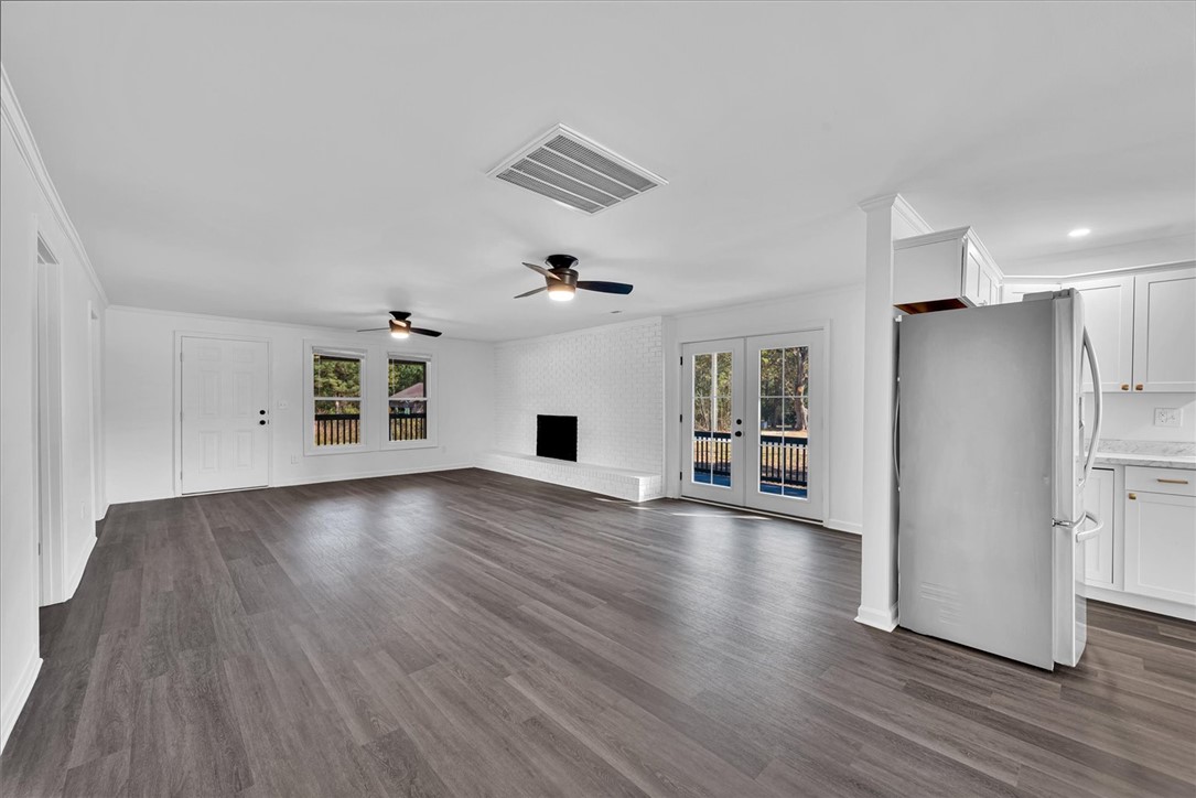 801 Cherokee Road Pelzer, SC 29669 - Photo 20 of 45 This bright and open space features durable flooring and a charming fireplace, perfect for gatherings.